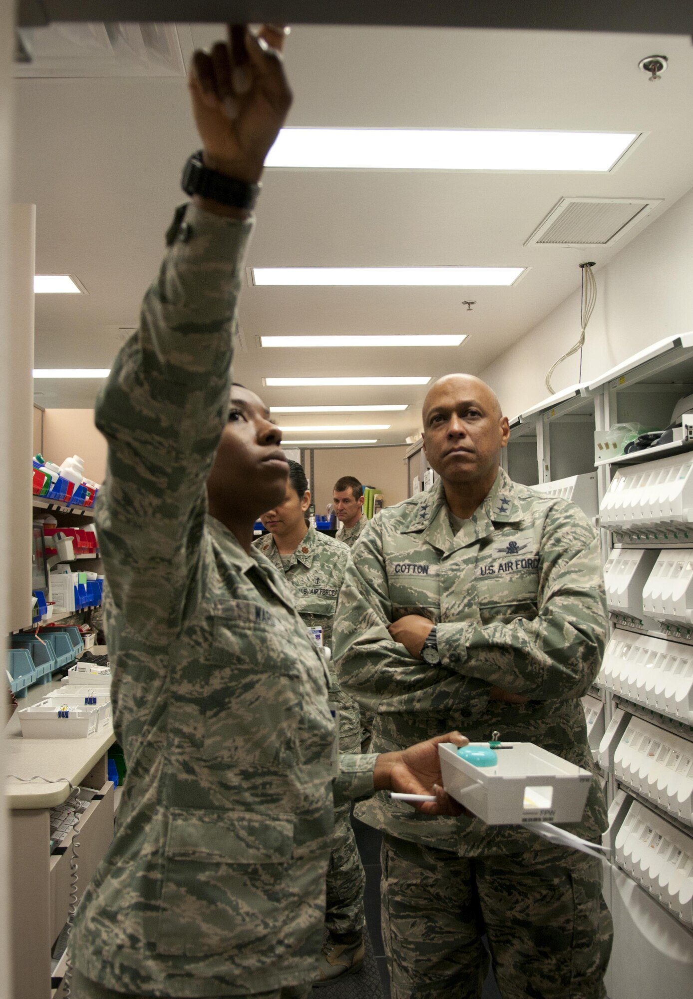 Airman 1st Class Jozalyn Ward, 90th Medical Support Squadron Pharmacy technician, shows Maj. Gen. Anthony Cotton, 20th Air Force and Task Force 214 commander, the process for filling out a prescription during a tour of the 90th Medical Group’s Medical Treatment Facility on F.E. Warren Air Force Base, Wyo., April 28, 2016. The pharmacy provides prescription services to the active duty Airmen on the base and many retirees in Cheyenne. (U.S. Air Force photo by Airman 1st Class Malcolm Mayfield)