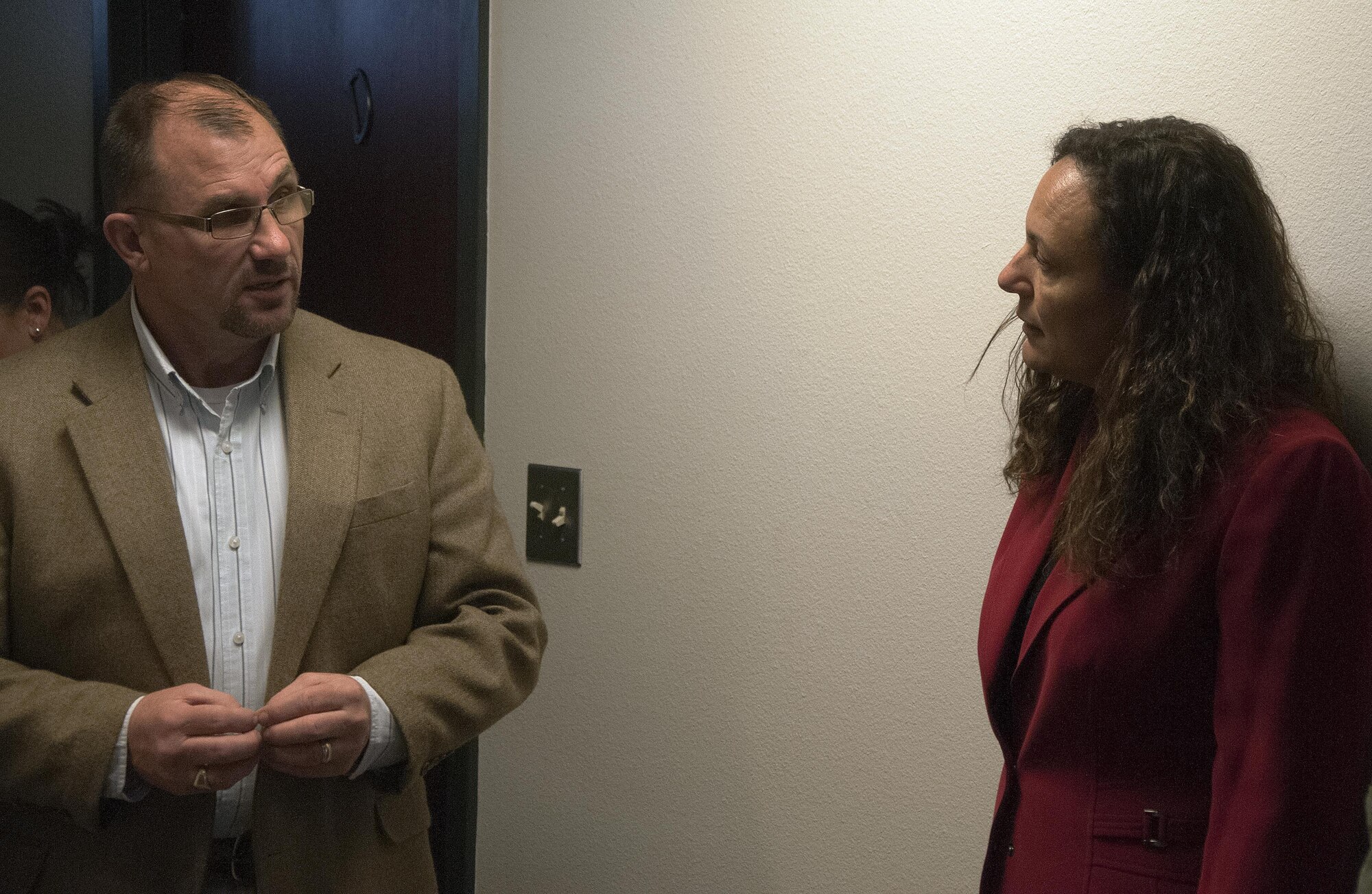 Richard Singhas, 90th Civil Engineer Squadron dorm manager, explains the layout of the single Airmen dormitories on F.E. Warren Air Force Base, Wyo., to Marsha Cotton, wife of Maj. Gen. Anthony Cotton, 20th Air Force and Task Force 214 commander, April 28, 2016. Cotton toured the dormitories and family quarters to learn about the available housing opportunities on base. (U.S. Air Force photo by Senior Airman Brandon Valle)