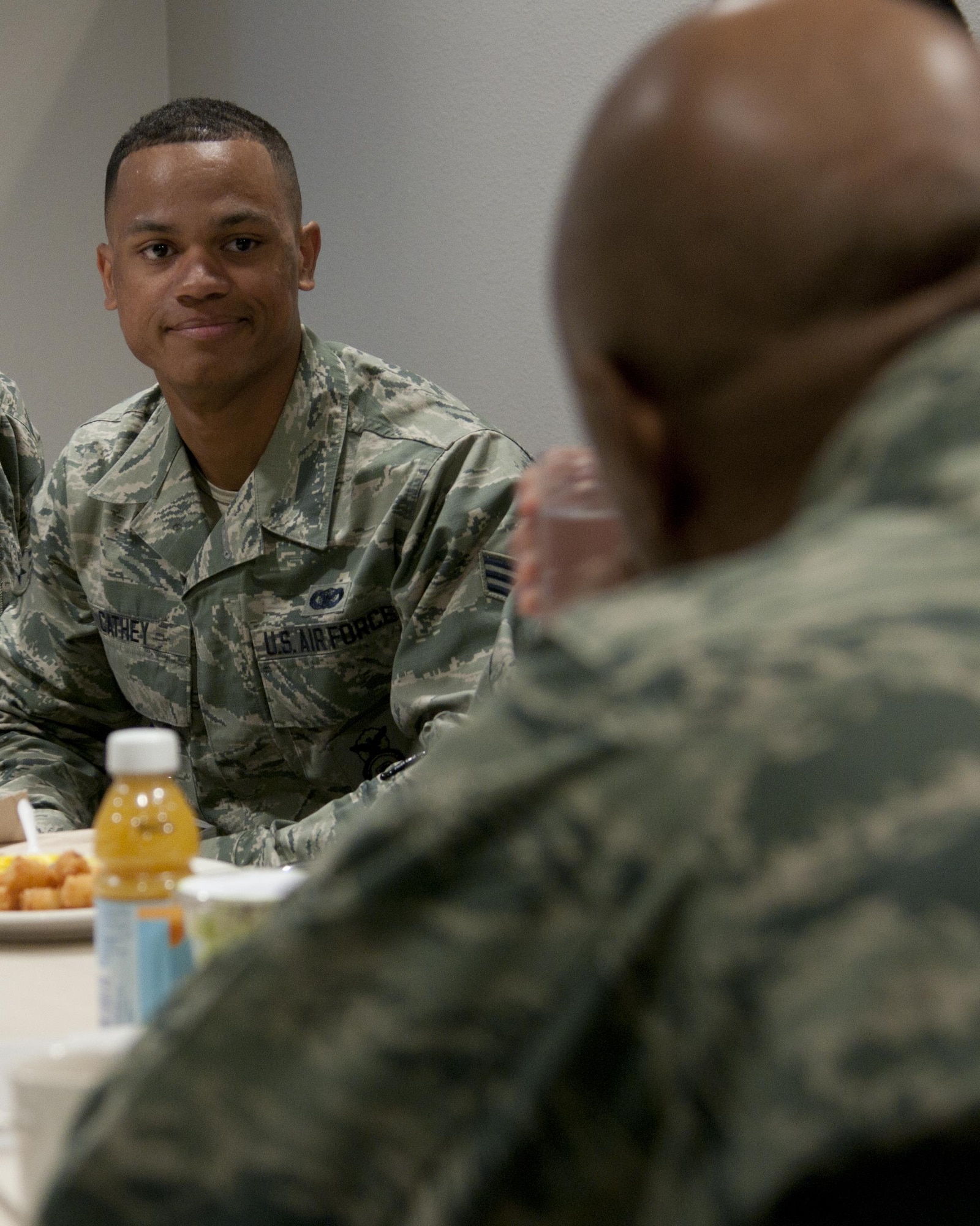 Senior Airman Jason Cathey, 90th Security Forces Group, listens to Maj. Gen. Anthony Cotton, 20th Air Force and Task Force 214 commander, during Cotton’s breakfast with Airmen at the Chadwell Dining Facility, on F.E. Warren Air Force Base, Wyo., April 28, 2016. During the meal different programs for the base and issues from around the wing were discussed. (U.S. Air Force photo by Airman 1st Class Malcolm Mayfield)