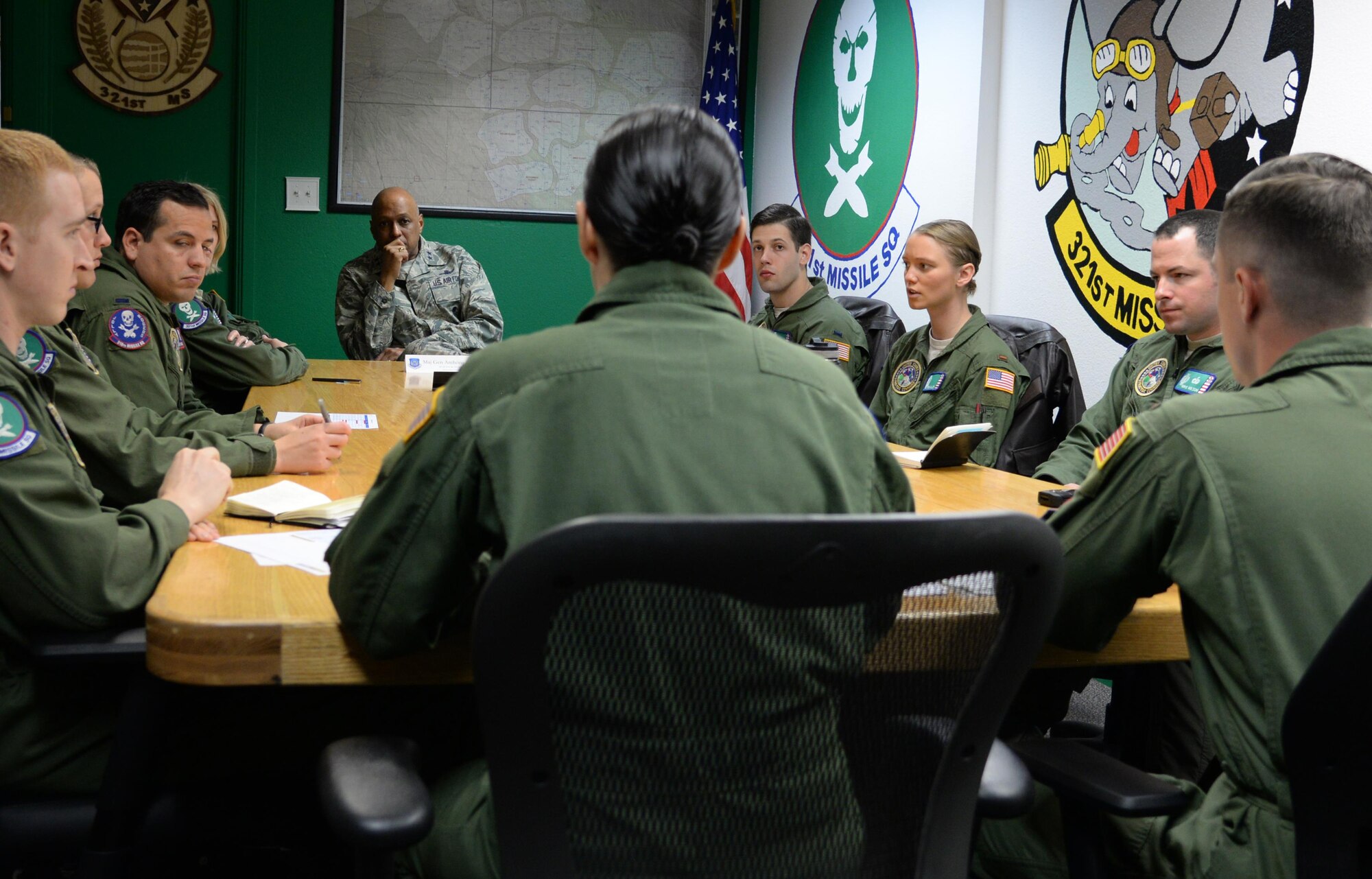 Maj. Gen. Anthony Cotton, 20th Air Force and Task Force 214 commander, listens at a meeting held by the 321st Missile Squadron in the 90th Operations Group building, April 28, 2016, on F.E. Warren Air Force Base, Wyo. This is Cotton’s second time visiting the wing since assuming command in November. (U.S. Air Force photo by Airman 1st Class Malcolm Mayfield)