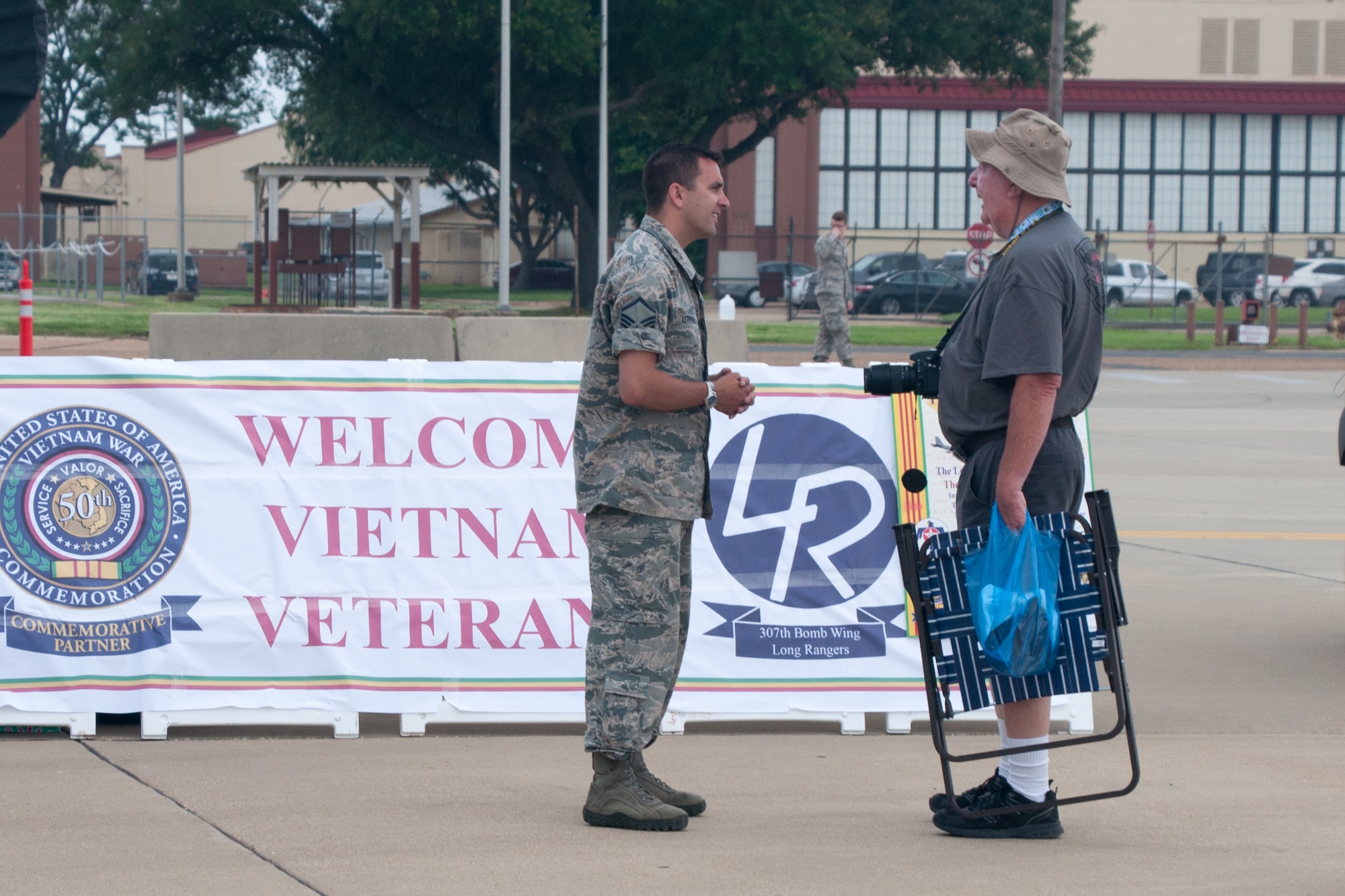 Master Sgt. Jeremy Utphall, of the 307th Bomb Wing, speaks to a veteran from the Vietnam War during the Barksdale Defenders of Liberty Air Show on Barksdale Air Force Base, La., May 1, 2016. The Wing is a partner with the United States of America Vietnam War Commemoration recognizing veterans’ sacrifices during the 50th anniversary of the Vietnam War. (U.S. Air Force photo by Master Sgt. Dachelle Melville/Released)