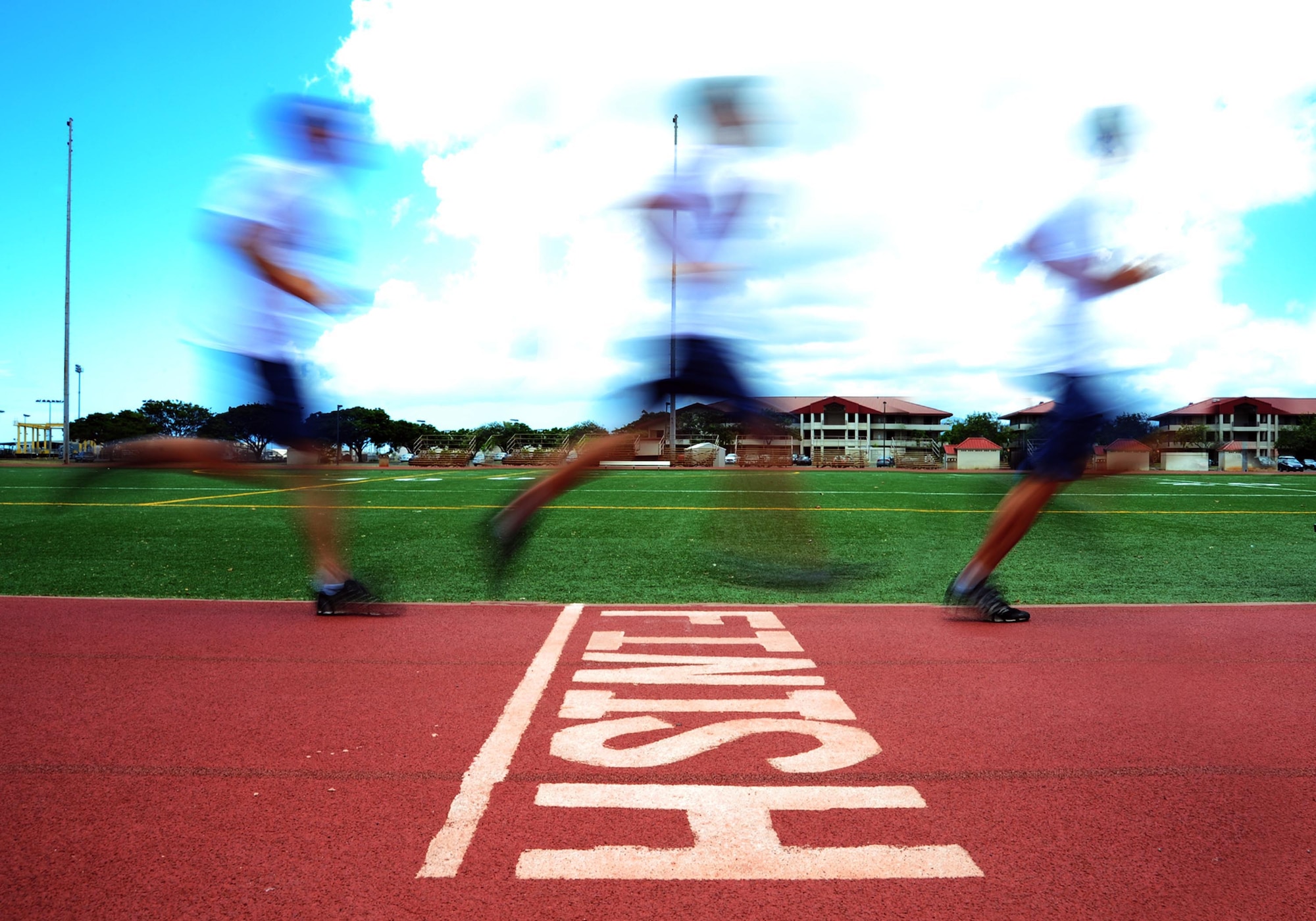 1st Lt. Paul Fracolli, 19th Fighter Squadron, crosses the finish line on the Earhart Track at Joint Base Bear Harbor-Hickam, Hawaii, April 29, 2016. Fracolli recently beat the Hickam physical training test record with a mile and a half run in 7:55. (U.S. Air Force illustration by 2nd Lt. Kaitlin Daddona/Released). 