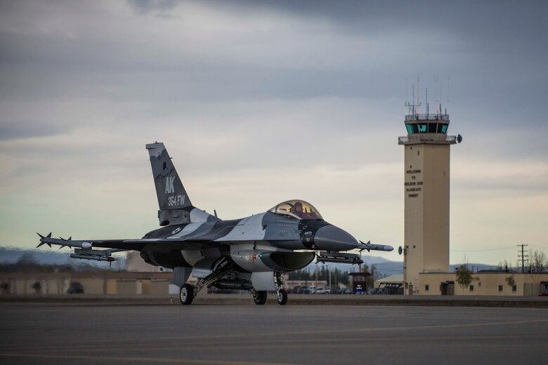 A U.S. Air Force F-16 Fighting Falcon assigned to the 18th Aggressor Squadron taxis on the Eielson Air Force Base, Alaska flightline, May 2, 2016, during RED FLAG-Alaska (RF-A) 16-1. RF-A is a two-week long exercise that takes place within the Joint Pacific Alaska Range Complex, a 67,000 square-mile training range, the largest instrumented air, ground and electronic combat training range in the world. (U.S. Air Force photo by Staff Sgt. Joshua Turner/Released)