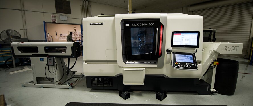 After one side of a part is finished the double spindle lathe (DMG NLX-2500/700 SY), will spin and work on the other side without an Airman having to manually reposition the part. The tools that are in the machine spin at up to 10,000 revolutions per minute in order for the machine to perform milling operations while the part is already spinning. (U.S. Air Force photo/Airman 1st Class Sean Campbell)