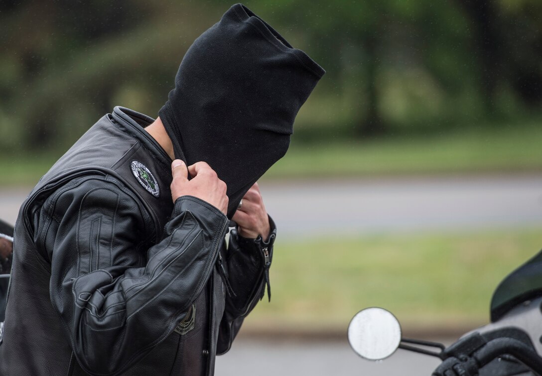 A member of the Green Knights Military Motorcycle Club prepares for the 5th annual Standing Together Against Rape Road Rally at Langley Air Force Base, Va., April 29, 2016. For riders to participate in the event, their motorcycles had to go through a safety check and riders received a safety briefing. (U.S. Air Force photo by Senior Airman Kayla Newman)