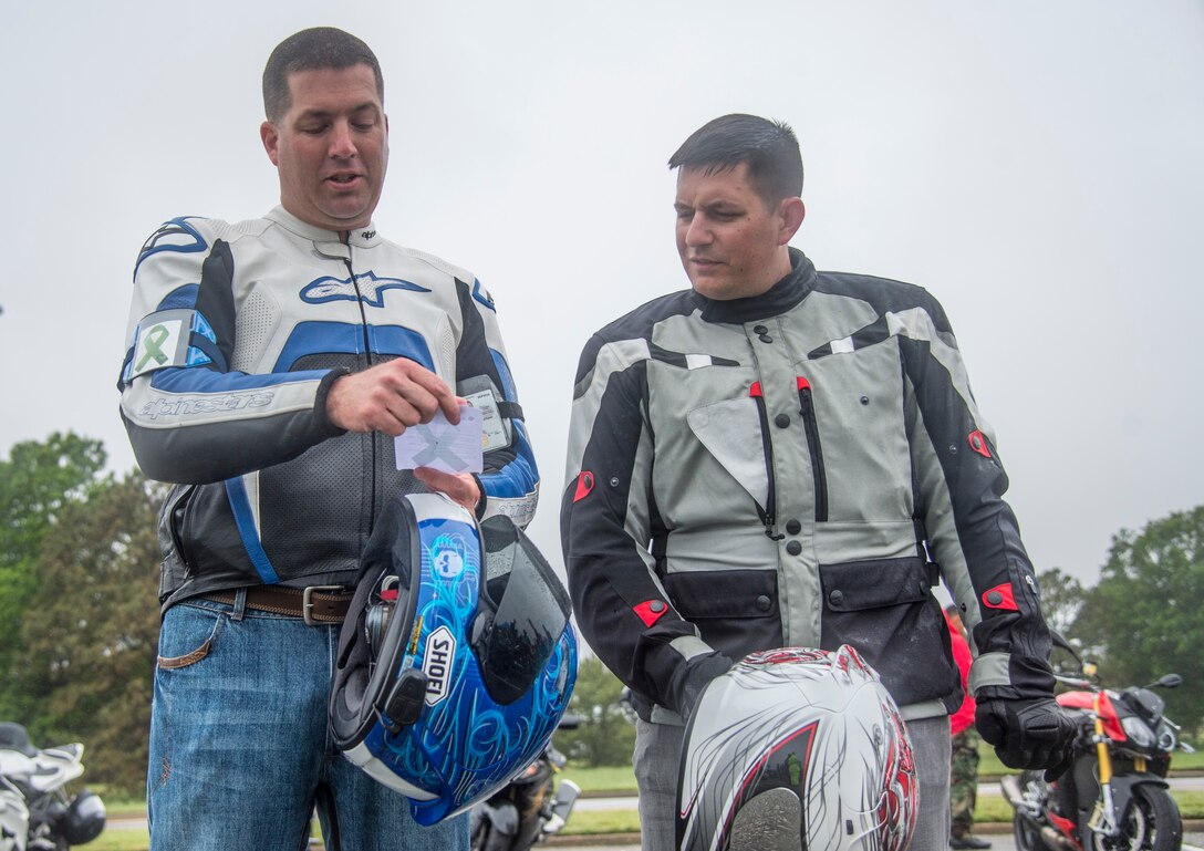 Two motorcyclists recite a pledge during the 5th annual Standing Together Against Rape Road Rally at Langley Air Force Base, Va., April 29, 2016. The riders pledged to “Know Our Part” and “Do Our Part” in an effort to eliminate sexual assault. (U.S. Air Force photo by Senior Airman Kayla Newman)