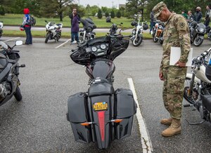 U.S. Army Col. Joseph E. Ladner, vice commander of the 633rd Air Base Wing, checks out a motorcycle during the 5th annual Standing Together Against Rape Road Rally at Langley Air Force Base, Va., April 29, 2016. The event aimed to increase awareness by standing together in an effort to eliminate sexual assault. (U.S. Air Force photo by Senior Airman Kayla Newman)