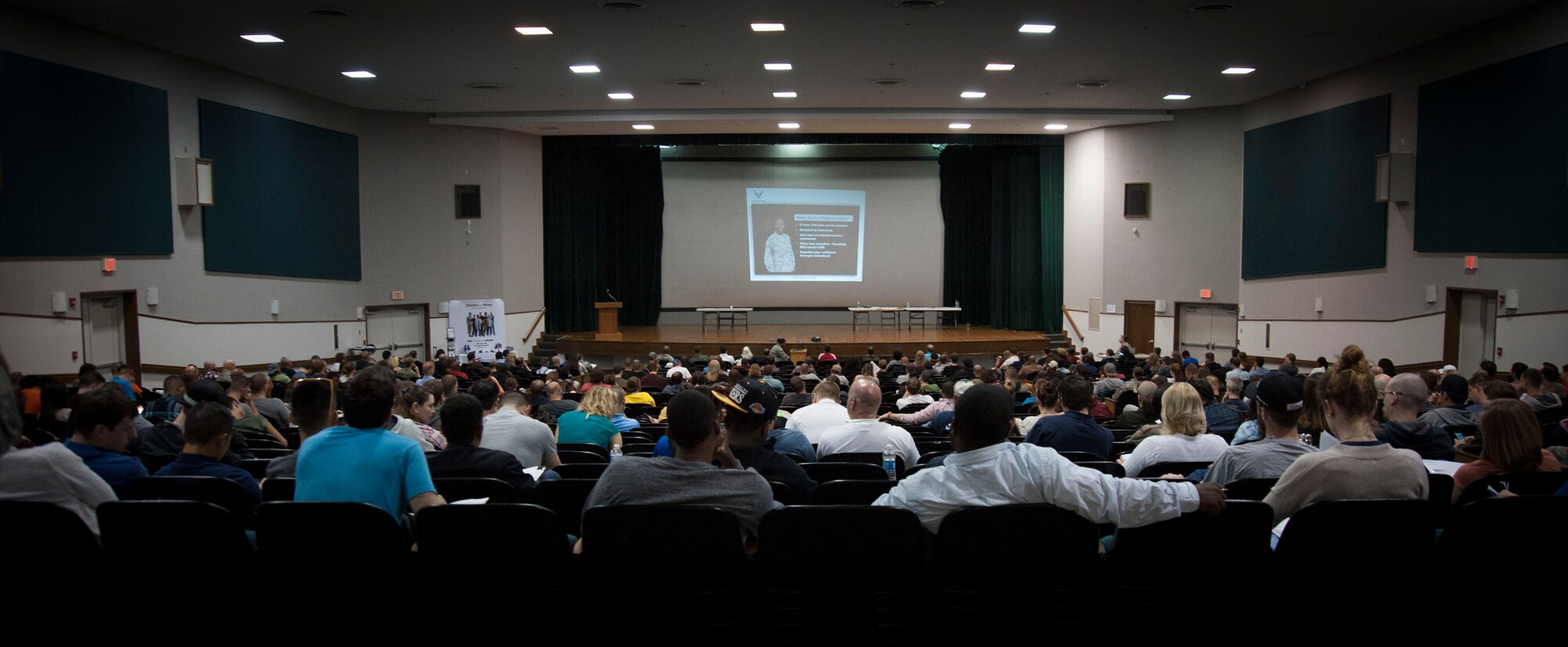 Members of the individual ready reserve watch a video brief during an IRR muster in the base theater at Joint Base Andrews, Md., April 23, 2016. The muster allowed IRR members to update personal information and receive briefings and information on IRR benefits. (U.S. Air Force Photo by Airman 1st Class Rustie Kramer/Released) 