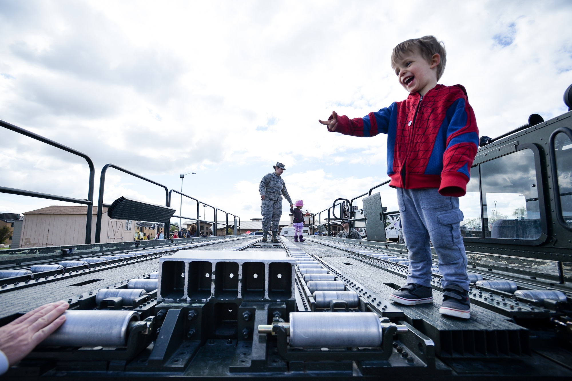Christian Barwick smiles while exploring a Tunner 60K loader during the Wheels of Wonder Event, April 29, 2016, Hill Air Force Base, Utah. Event goers were allowed a hands-on experience with a wide variety of military and civilian wheeled vehicles. (U.S. Air Force photo by R. Nial Bradshaw)