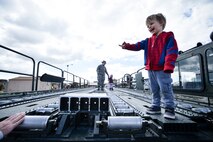 Christian Barwick smiles while exploring a Tunner 60K loader during the Wheels of Wonder Event, April 29, 2016, Hill Air Force Base, Utah. Event goers were allowed a hands-on experience with a wide variety of military and civilian wheeled vehicles. (U.S. Air Force photo by R. Nial Bradshaw)