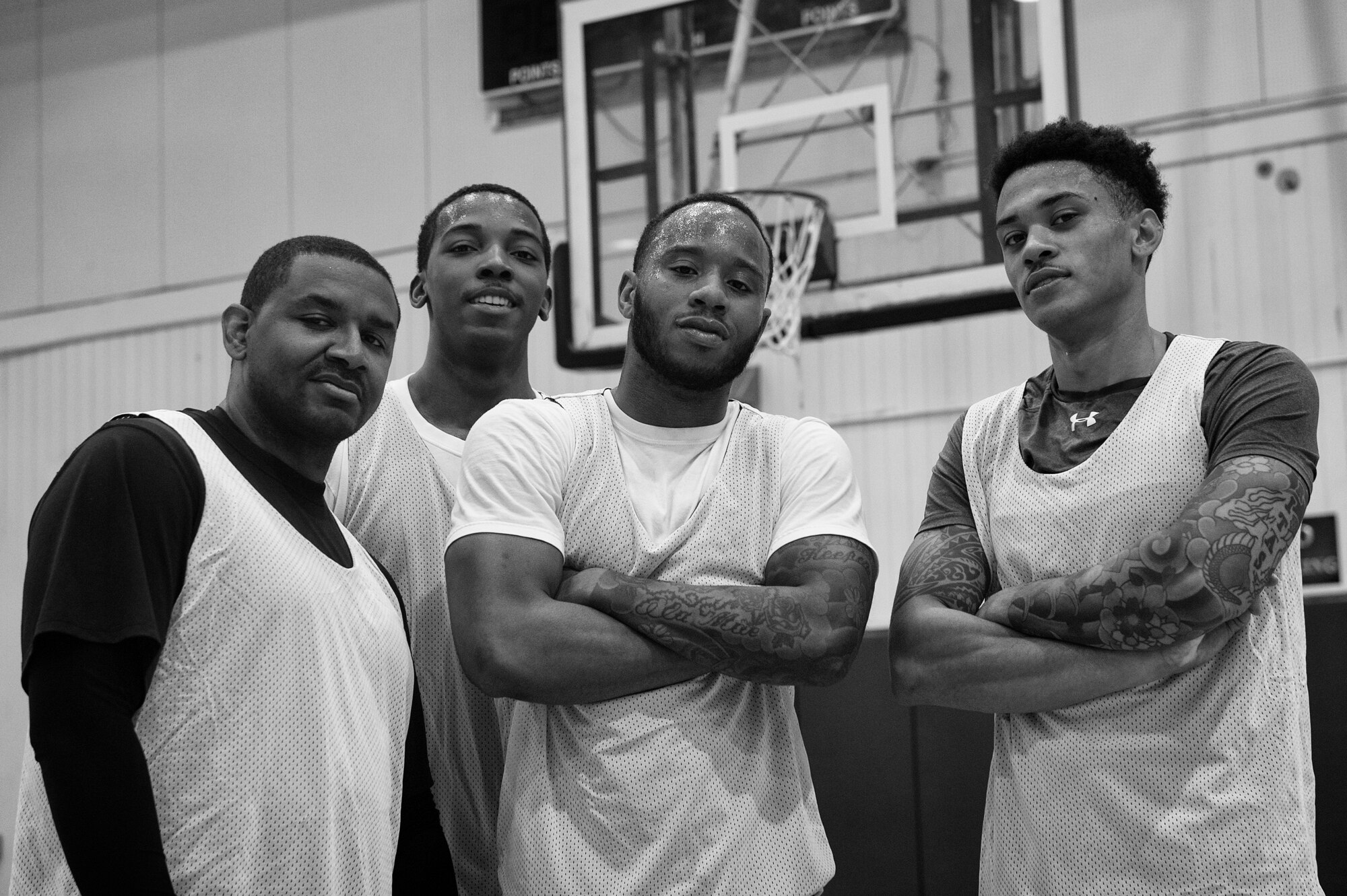Yokota members pose for a photo after winning a 3-on-3 basketball tournament at Yokota Air Base, Japan, April 29, 2016. The event was hosted by the 374th Airlift Wing sexual assault prevention and response team to increase awareness regarding sexual assault and promote an assault-free community. (U.S. Air Force photo by Senior Airman Delano Scott/Released)