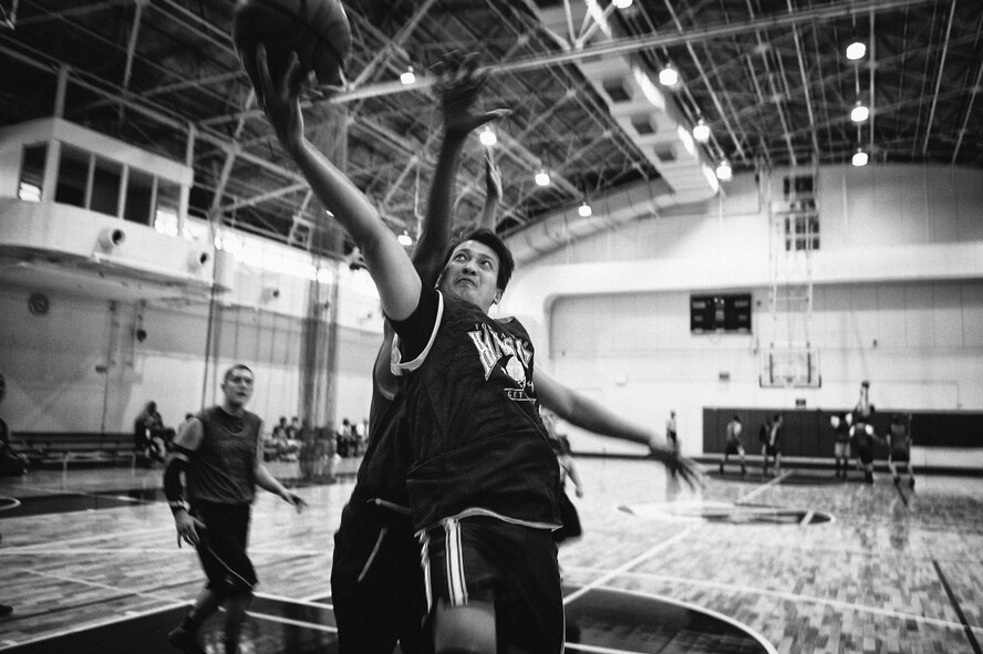 A 3-on-3 basketball tournament participant goes in for a layup at Yokota Air Base, Japan, April 29, 2016. The 374th Airlift Wing sexual assault prevention and response team provides direct interpersonal support, crisis intervention and informed decisions regarding restricted and unrestricted reporting. (U.S. Air Force photo by Senior Airman Delano Scott/Released)
