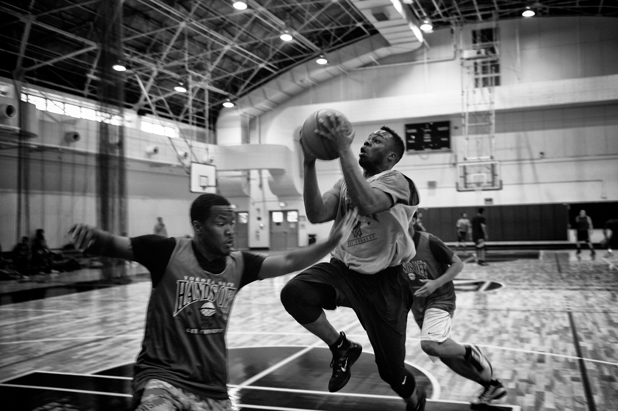 Airman 1st Class Felix Nenuz, 374th Civil Engineer Squadron electrical systems technician, goes in for a layup during a 3-on-3 basketball tournament at Yokota Air Base, Japan, April 29, 2016. The 374th Airlift Wing sexual assault response coordinator team used the tournament to provide a fun event to base members and as a platform to spread awareness for sexual assault. (U.S. Air Force photo by Senior Airman Delano Scott/Released)