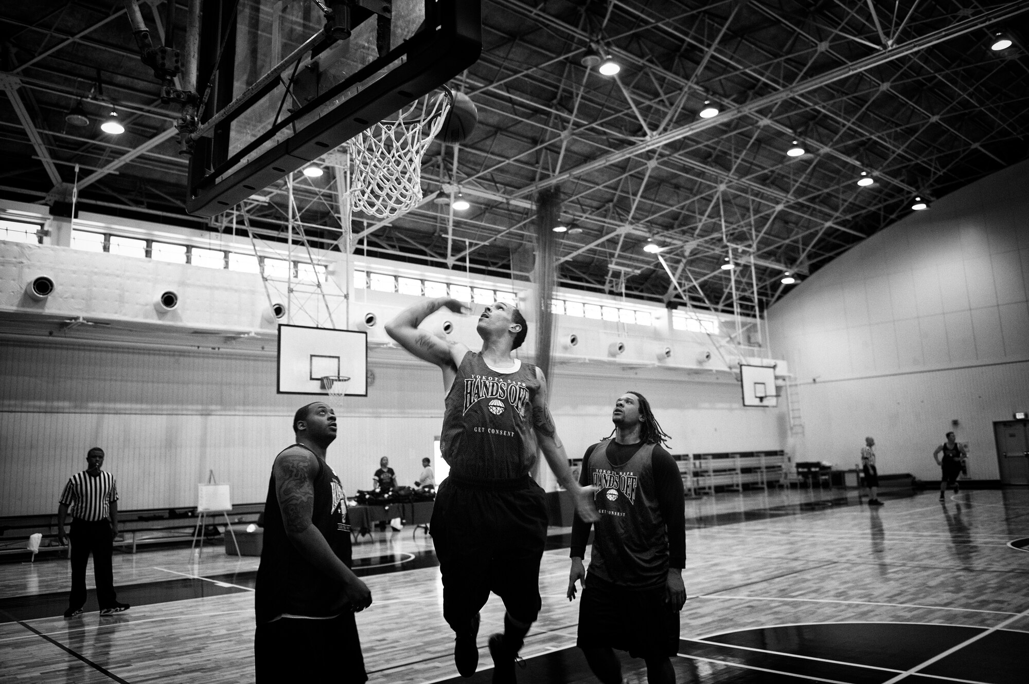 A Yokota member takes a shot during a 3-on-3 basketball tournament at Yokota Air Base, Japan, April 29, 2016. The event was hosted by the 374th Airlift Wing sexual assault response coordinator team to increase awareness regarding sexual assault and promote an assault-free community. (U.S. Air Force photo by Senior Airman Delano Scott/Released) 