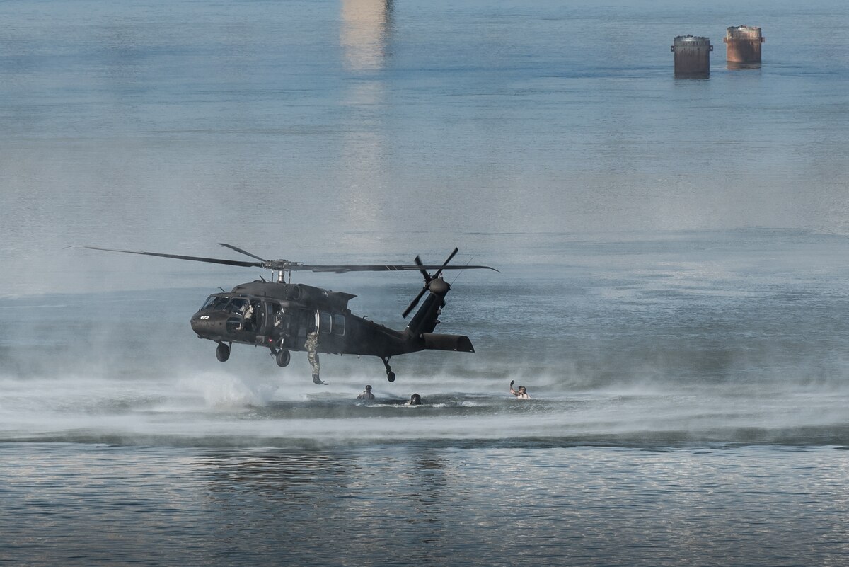 Combat controllers and pararescuemen from the Kentucky Air National Guard’s 123rd Special Tactics Squadron jump from a Kentucky Army National Guard UH-60 Blackhawk helicopter into the Ohio River during the Thunder Over Louisville air show in downtown Louisville, Ky., April 23, 2016. The demonstration displays techniques the Airmen use when recovering downed personnel or executing a covert insertion into enemy territory. (U.S. Air National Guard photo by Maj. Dale Greer)