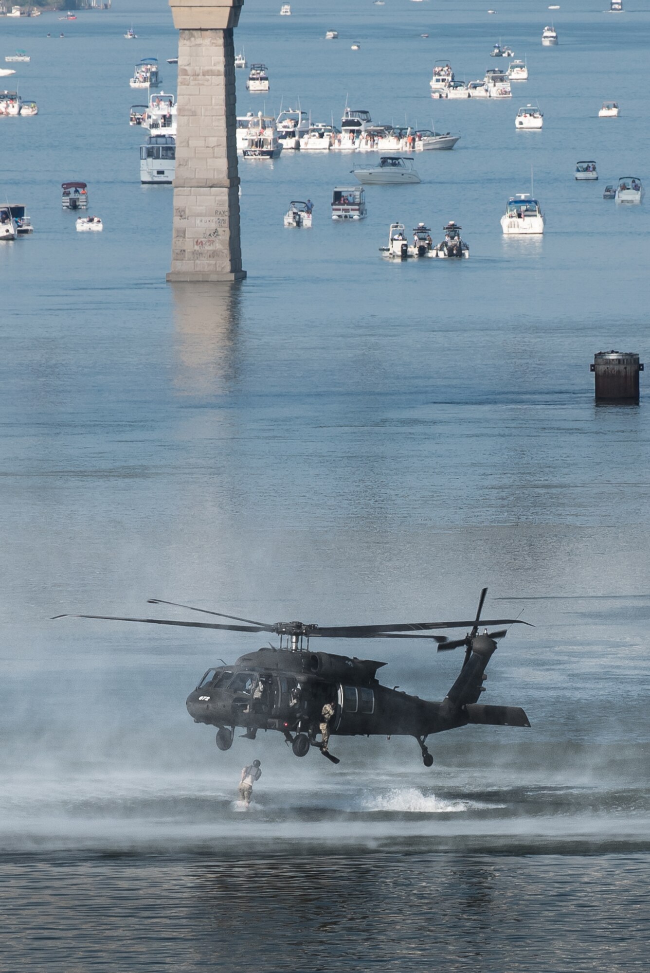 Combat controllers and pararescuemen from the Kentucky Air National Guard’s 123rd Special Tactics Squadron jump from a Kentucky Army National Guard UH-60 Blackhawk helicopter into the Ohio River during the Thunder Over Louisville air show in downtown Louisville, Ky., April 23, 2016. The demonstration displays techniques the Airmen use when recovering downed personnel or executing a covert insertion into enemy territory. (U.S. Air National Guard photo by Maj. Dale Greer)