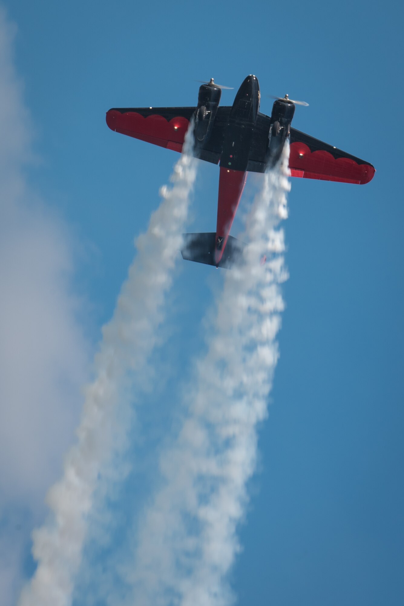 Matt Younkin performs aerobatic stunts with his Twin Beech 18 aircraft during the Thunder Over Louisville air show in downtown Louisville, Ky., April 23, 2016. The event drew an estimated crowd of 725,000 spectators to the banks of the Ohio River. (U.S. Air National Guard photo by Maj. Dale Greer)