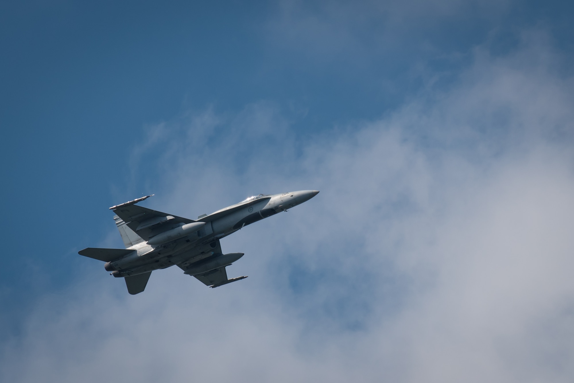 The pilot of a Royal Canadian Air Force CF-18 Hornet demonstrates the fighter jet’s advanced tactical capabilities during the Thunder Over Louisville air show in downtown Louisville, Ky., April 23, 2016. The event drew an estimated crowd of 725,000 spectators to the banks of the Ohio River. (U.S. Air National Guard photo by Maj. Dale Greer)