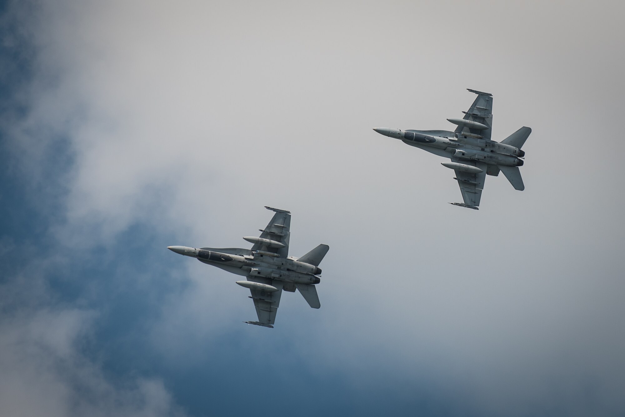 Two Royal Canadian Air Force CF-18 Hornet fighter jets perform during the Thunder Over Louisville air show in downtown Louisville, Ky., April 23, 2016. The event drew an estimated crowd of 725,000 spectators to the banks of the Ohio River. (U.S. Air National Guard photo by Maj. Dale Greer)