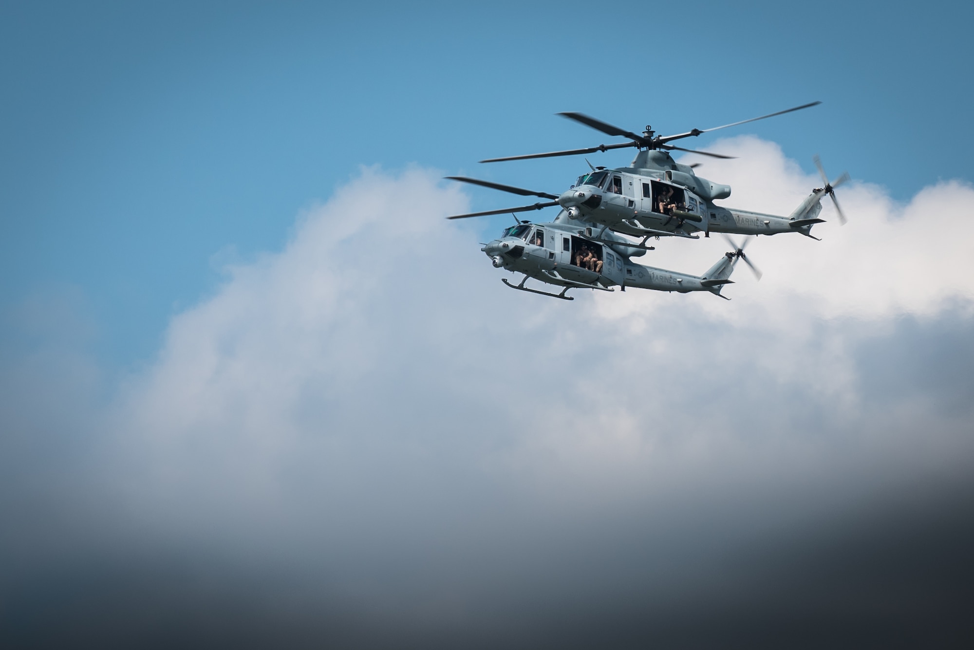 A pair of U.S. Marine Corps UH-1 Huey helicopters demonstrate their capabilities during the Thunder Over Louisville air show in downtown Louisville, Ky., April 23, 2016. The event drew an estimated crowd of 725,000 spectators to the banks of the Ohio River. (U.S. Air National Guard photo by Maj. Dale Greer)