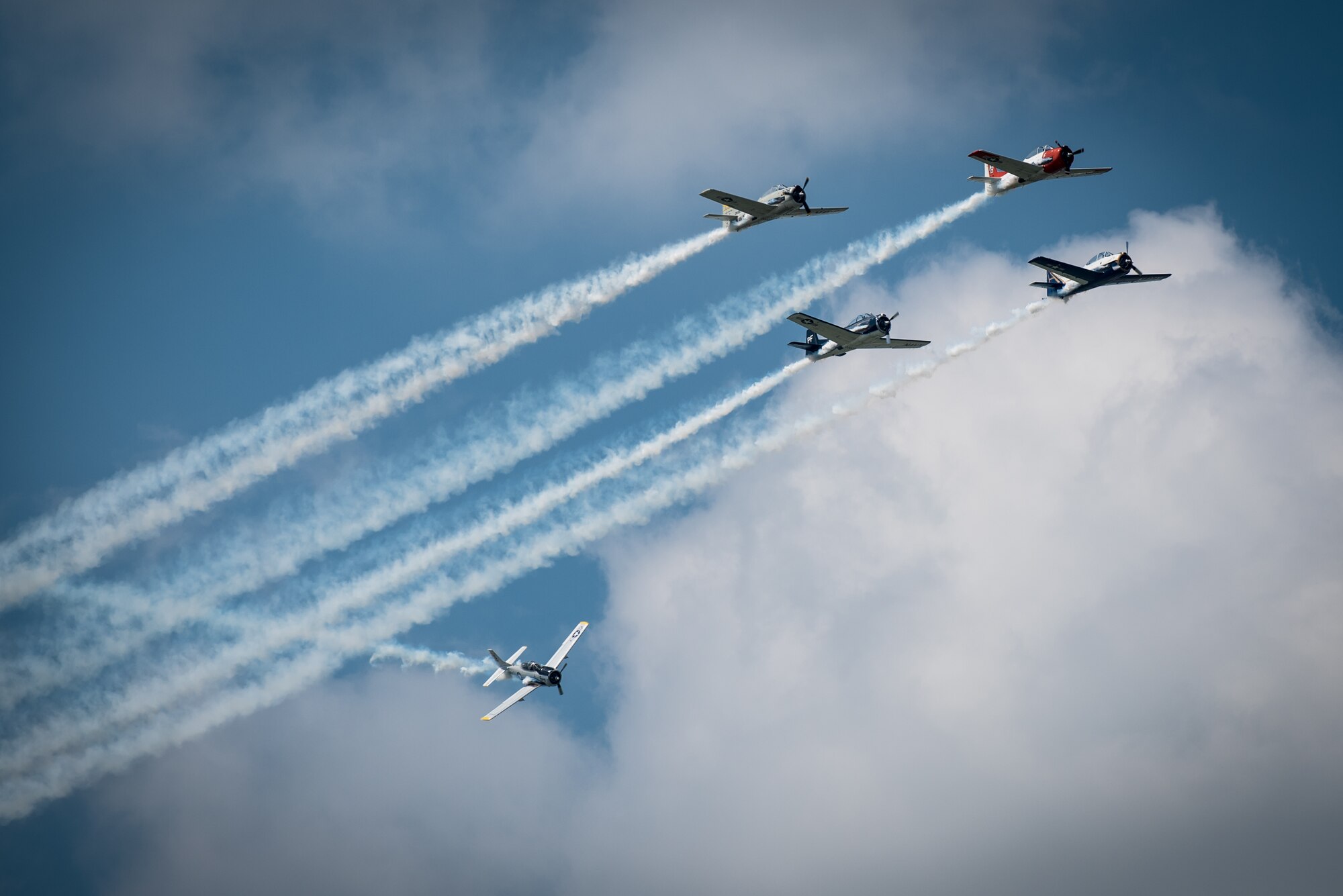 The Trojan Horsemen T-28 Demo Team performs aerobatic stunts during the Thunder Over Louisville air show in downtown Louisville, Ky., April 23, 2016. The event drew an estimated crowd of 725,000 spectators to the banks of the Ohio River. (U.S. Air National Guard photo by Maj. Dale Greer)