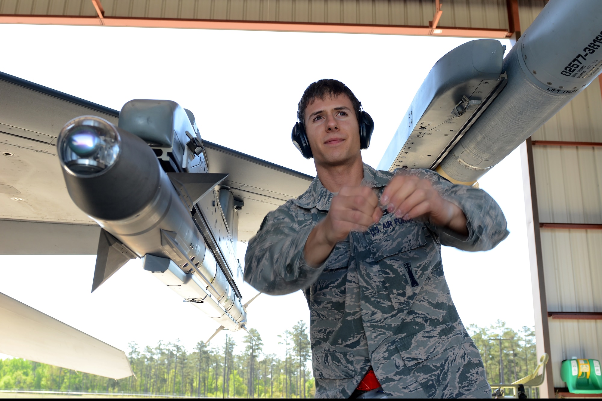 U.S. Air Force Senior Airman Curtis Nye, a weapons loader assigned to the South Carolina Air National Guard's 169th Maintenance Squadron, performs maintenance checks on an F-16 Fighting Falcon fighter jet at McEntire Joint National Guard Base, S.C., April 16, 2016. (U.S. Air National Guard photo by Senior Airman Ashleigh Pavelek)