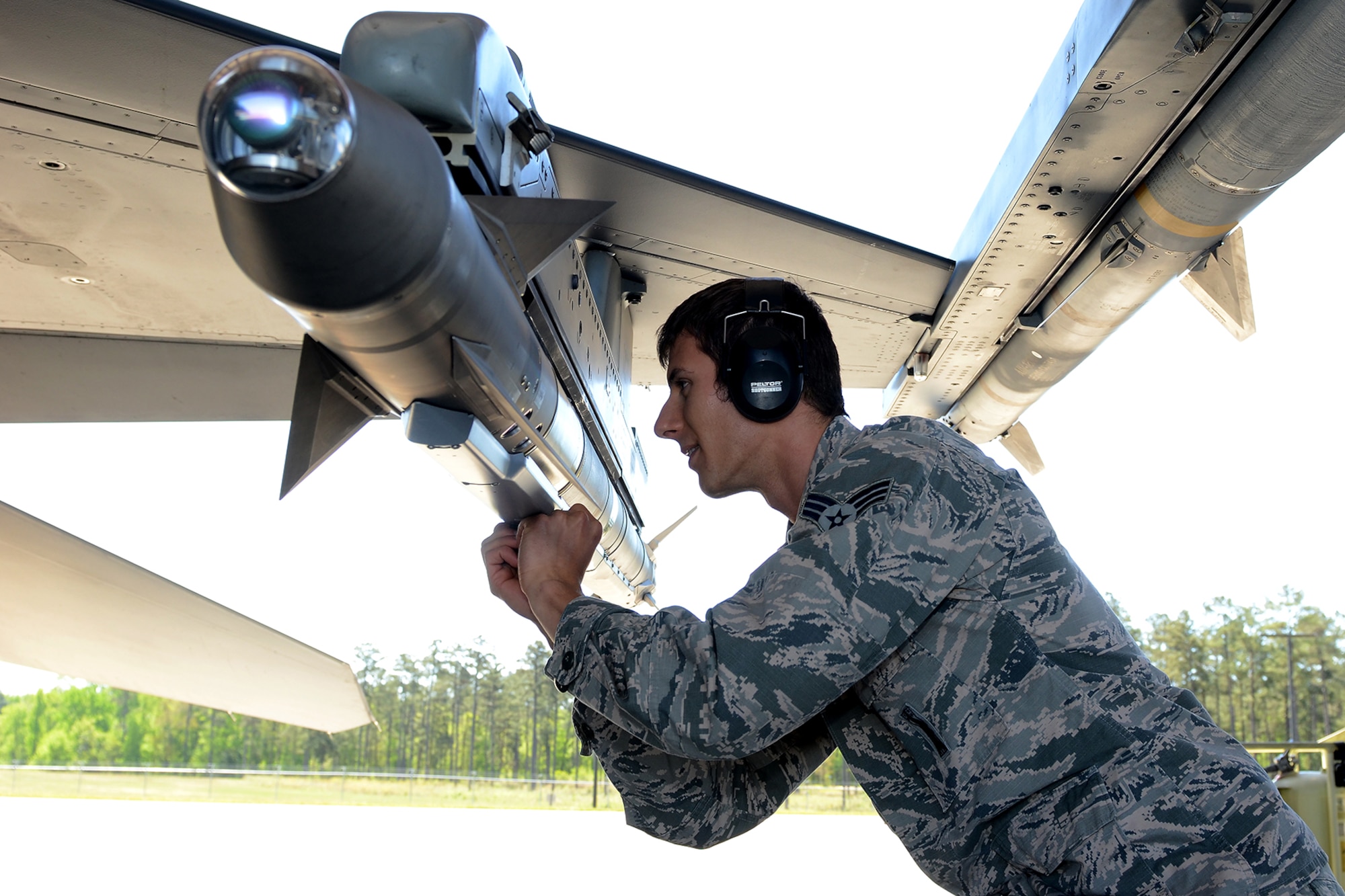 U.S. Air Force Senior Airman Curtis Nye, a weapons loader assigned to the South Carolina Air National Guard's 169th Maintenance Squadron, performs maintenance checks on an F-16 Fighting Falcon fighter jet at McEntire Joint National Guard Base, S.C., April 16, 2016. (U.S. Air National Guard photo by Senior Airman Ashleigh Pavelek)