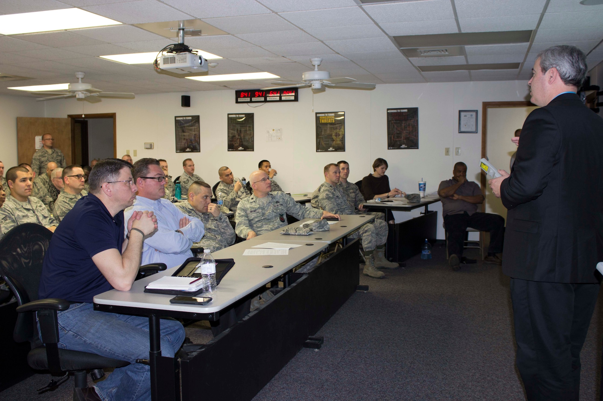 John Moroney, work management specialist at the Air Force Civil Engineer Center Operations Maintenance Division at Tyndall Air Force Base, Florida, discusses a business process training lesson at Scott AFB, Illinois, during an AFCEC team visit to the base in March 2016. The goal of the visit was to inform operations flight personnel of the organization and business process changes required to prepare for the NexGenIT initial operating capability. (Air Force Photo/Susan Lawson/Released)