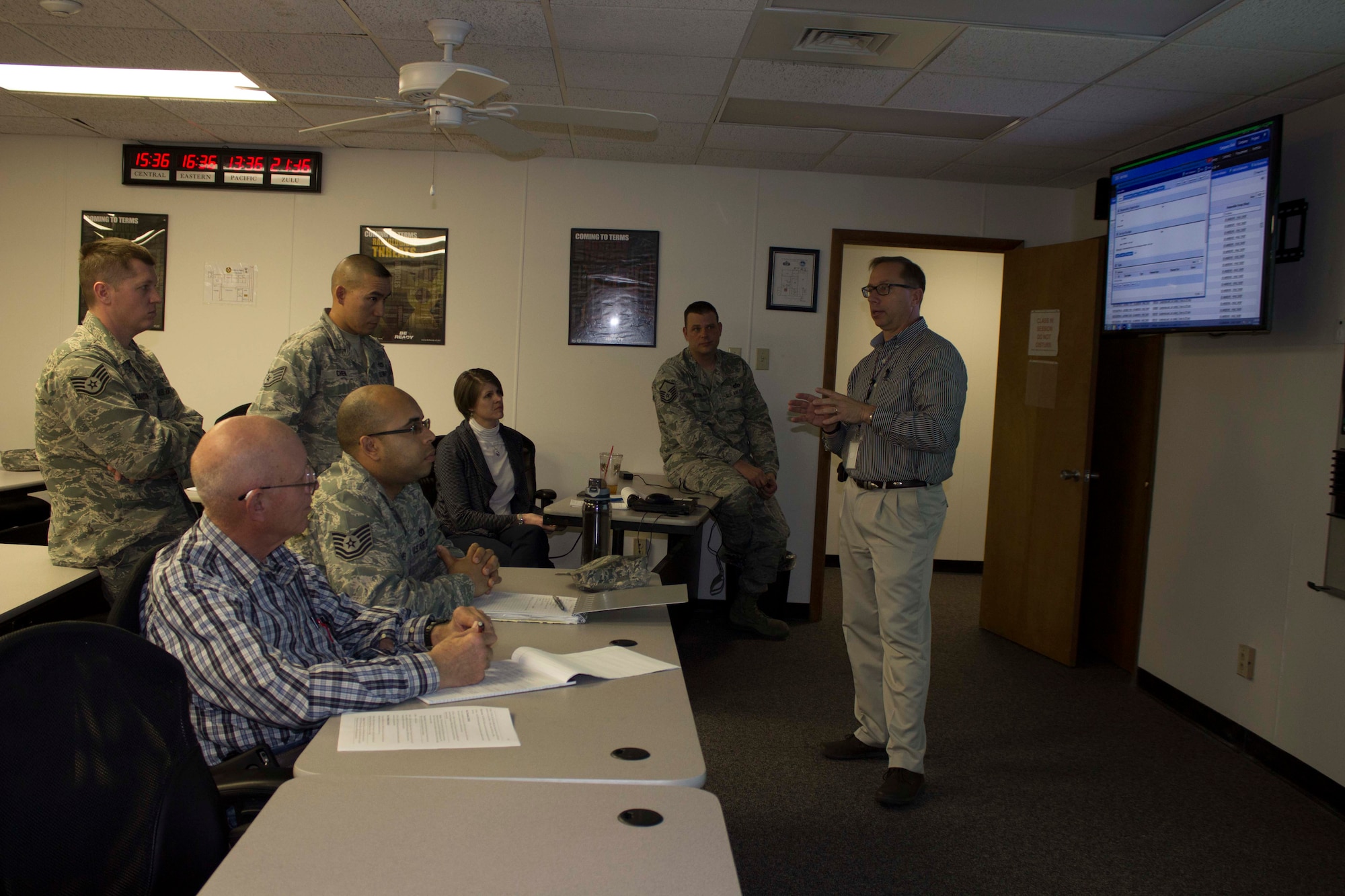 Gary Gentz, preventive maintenance program manager for the Air Force Civil Engineer Center Operations Maintenance Division at Tyndall Air Force Base, Florida, discusses business process scheduling with base personnel during business process review training during a March 2016 visit to Scott Air Force Base, Illinois. The goal of the visit was to inform operations flight personnel of the organization and business process changes required to prepare for the NexGenIT initial operating capability. (Air Force Photo/Susan Lawson/Released)