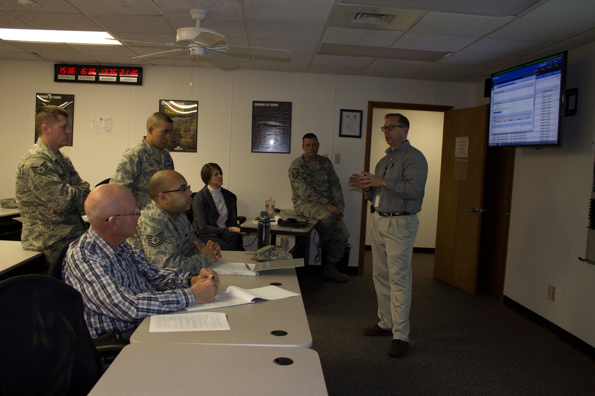 Gary Gentz, preventive maintenance program manager for the Air Force Civil Engineer Center Operations Maintenance Division at Tyndall Air Force Base, Florida, discusses business process scheduling with base personnel during business process review training during a March 2016 visit to Scott Air Force Base, Illinois. The goal of the visit was to inform operations flight personnel of the organization and business process changes required to prepare for the NexGenIT initial operating capability. (Air Force Photo/Susan Lawson/Released)