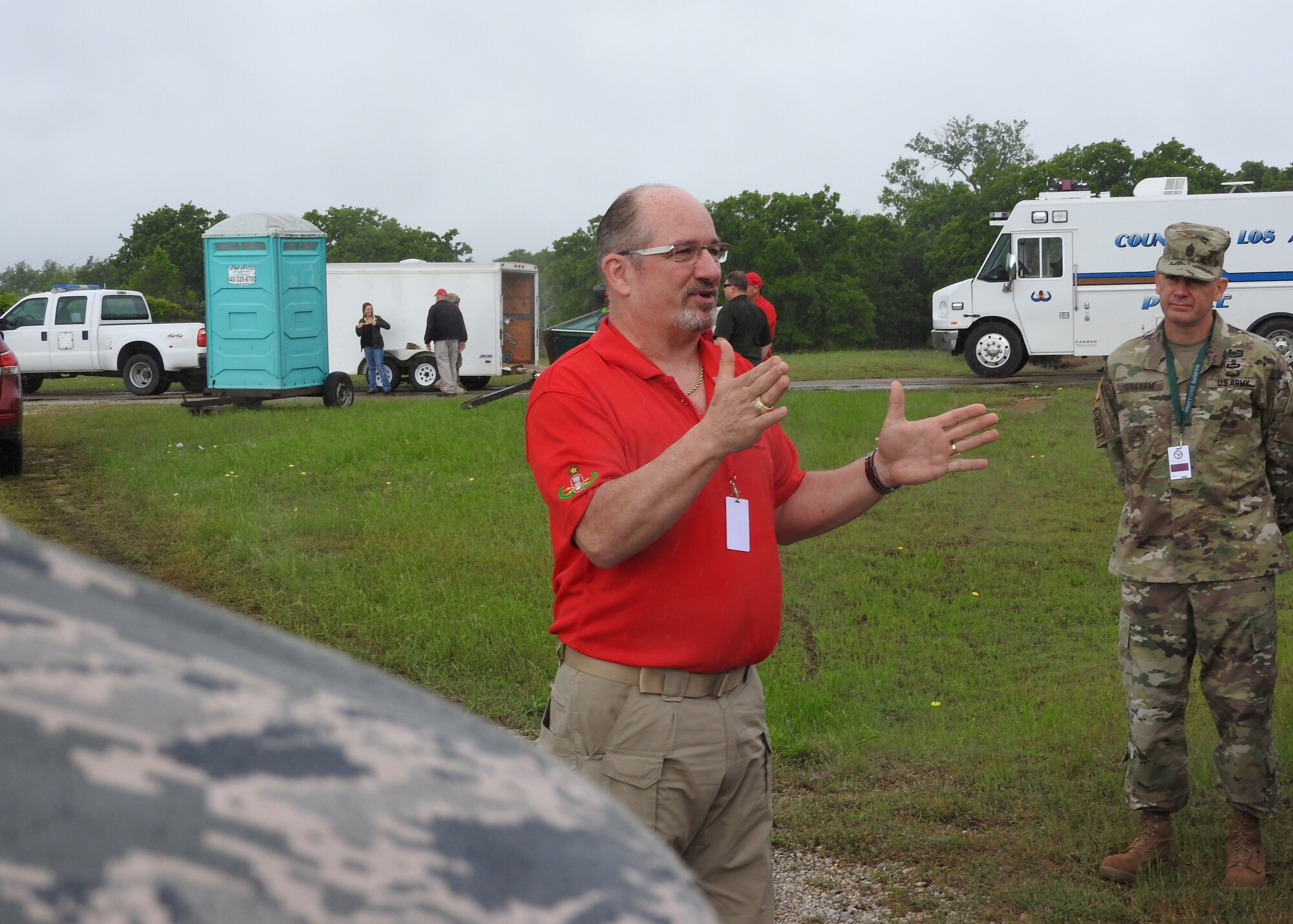 Raven’s Challenge X program manager John Simpson explains a bus scenario at Fort Wolters, Texas, April 20, 2016. The exercise involved hostages aboard a city bus with an incendiary explosive device. (U.S. Air Force Photo/Steve Warns/Released)