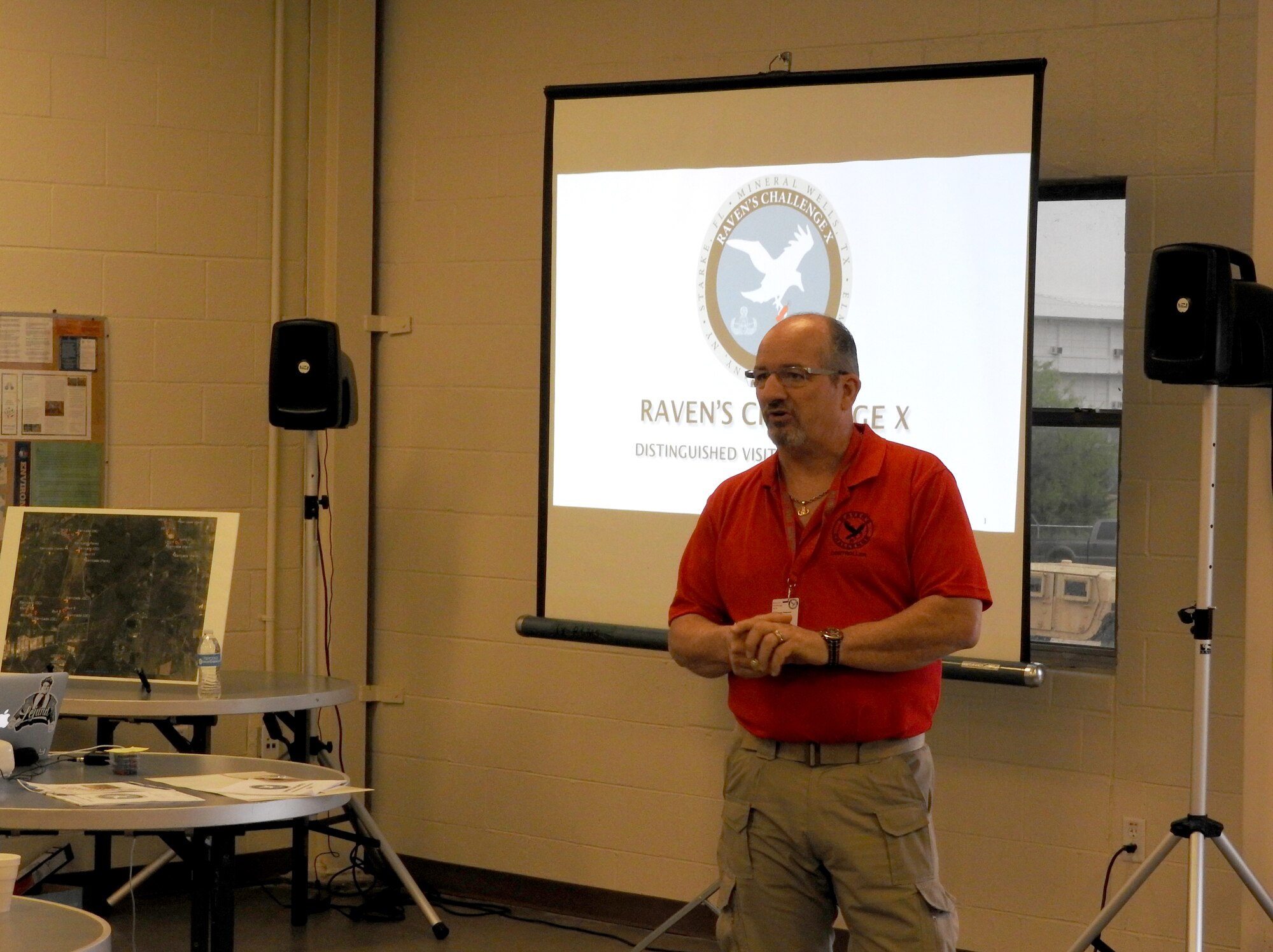 Raven’s Challenge X program manager John Simpson briefs participants and advisors at Fort Wolters, Texas, April 20, 2016. Raven’s Challenge brought together explosive ordnance disposal technicians from the U.S. Air Force; U.S. Army; ATF; FBI; and local law enforcement to merge resources and perform counter-IED operations together in real-world scenarios. (U.S. Air Force Photo/Steve Warns/Released)