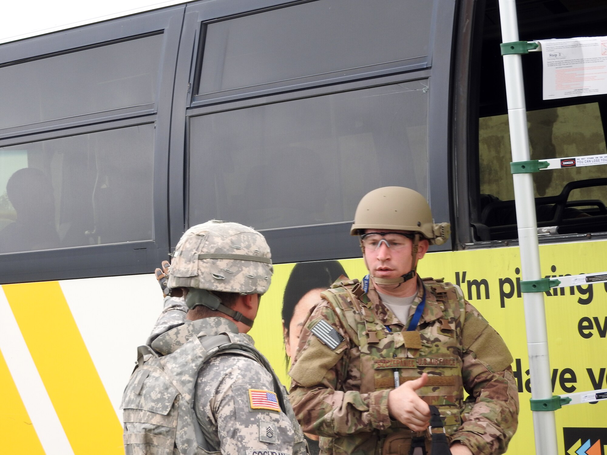 Technical Sgt. Russell Szczepaniec of the 301st Civil Engineer Squadron, Naval Air Station Fort Worth Joint Reserve Base, works with an Army EOD technician during a bus lane exercise at Raven’s Challenge X at Fort Wolters, Texas, April 20, 2016. (U.S. Air Force Photo/Steve Warns/Released)