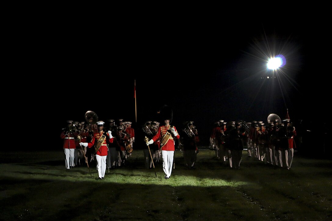 The United States Marine Band and United States Marine Drum and Bugle Corps perform during the Friends and Family Evening Parade at Marine Barracks Washington, D.C., April 29, 2016. The guest of honor for the evening was Gen. Robert Neller, commandant of the Marine Corps, and the hosting official was Col. Benjamin T. Watson, commanding officer, MBW. (Official Marine Corps photo by Staff Sgt. Michael Coleman/Released)