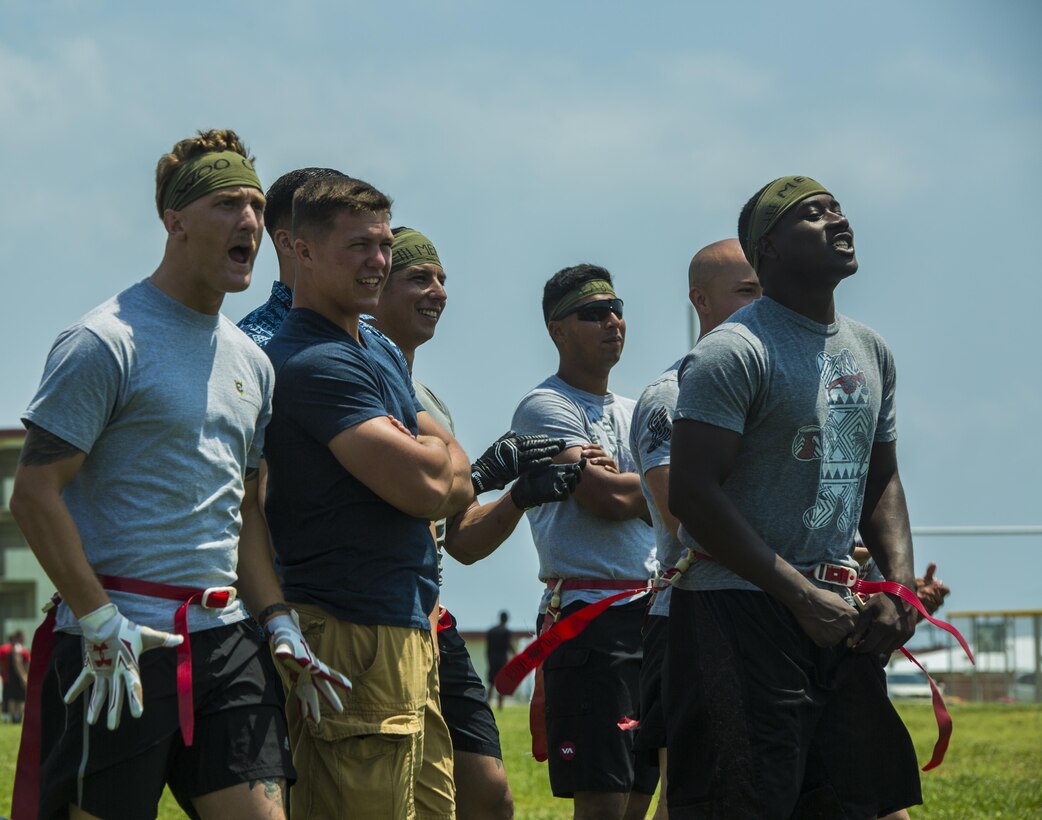 CAMP HANSEN, Okinawa, Japan – Marines and sailors with III Marine Expeditionary Force cheer on their teammates during a game of flag football April 29, 2016 on Camp Hansen, Okinawa, Japan. The game was part of a half-day event to raise funds for the Navy Marine Corps Relief Society by participating in competitive group sports. There are many ways the NMCRS can help Marines and sailors in times of need, including by providing interest-free loans and other financial assistance.