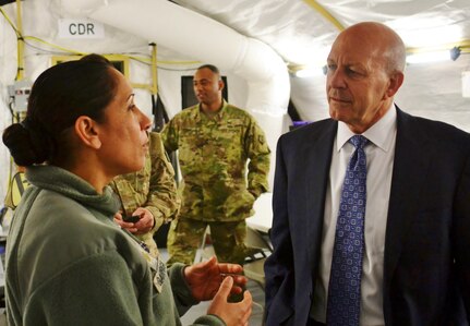 Maj. Maritza Garriga, left, talks to retired Vice Adm. Michael LeFever, a senior mentor during Exercise Anakonda Response16 Friday, April 29, 2016 at Papa Air Base in Papa, Hungary. The exercise simulates a multinational response to a catastrophic flood. (Photo by Tech. Sgt. Andria Allmond)