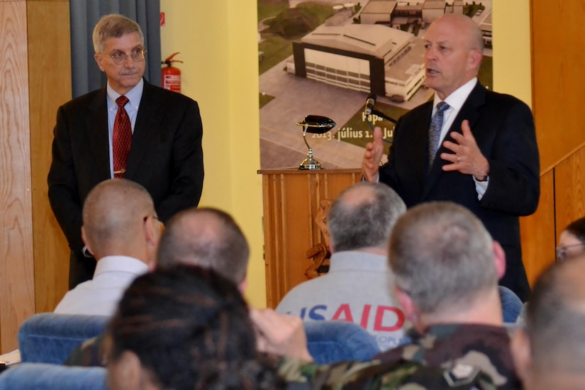 Retired Ambassador David Litt, left, and retired Vice Adm. Michael LeFever, senior mentors, speak to participants of Exercise Anakonda Response 2016 Thursday, April 28, 2016 at Papa Air Base in Papa, Hungary. The exercise simulates a multinational response to a catastrophic flood. (Photo by Tech. Sgt. Andria Allmond)