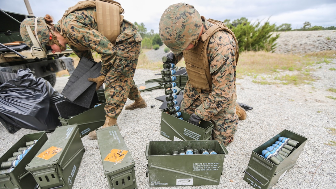 Marines with Combat Logistics Regiment 2 prepare MK-19 automatic grenade launcher ammunition for familiarization training at shooting range G-3 at Marine Corps Base Camp Lejeune, Apr. 29, 2016.  The training honed their accuracy, communication abilities and suppressive fire capabilities. 