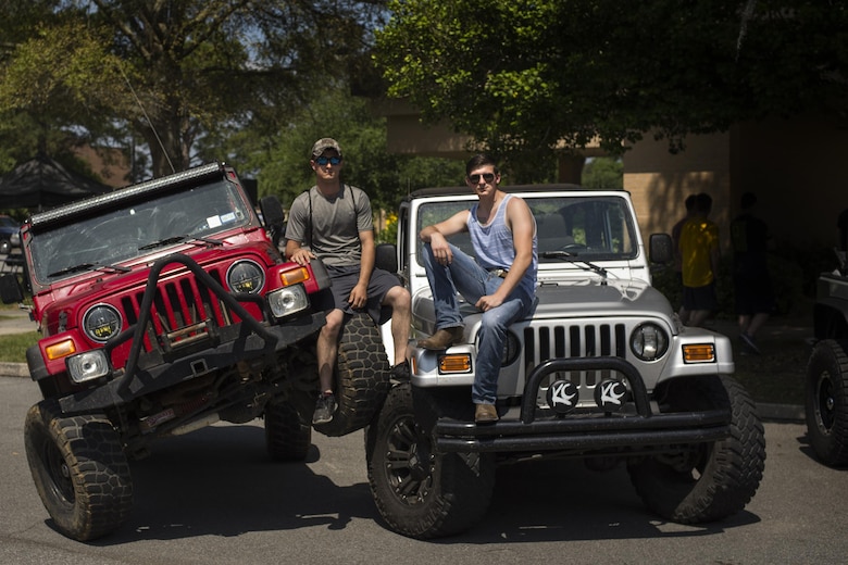 U.S. Air Force Senior Airmen Ryan Culbertson, left, and Joshua Setzer, 723d Aircraft Maintenance Squadron crew chiefs, pose with their vehicles during Comprehensive Airmen Fitness day, April 29, 2016, at Moody Air Force Base, Ga. The goal of this CAF day was to support the social pillar by assisting Airmen in building bonds with people of similar interests. (U.S. Air Force photo by Airman Daniel Snider/Released)