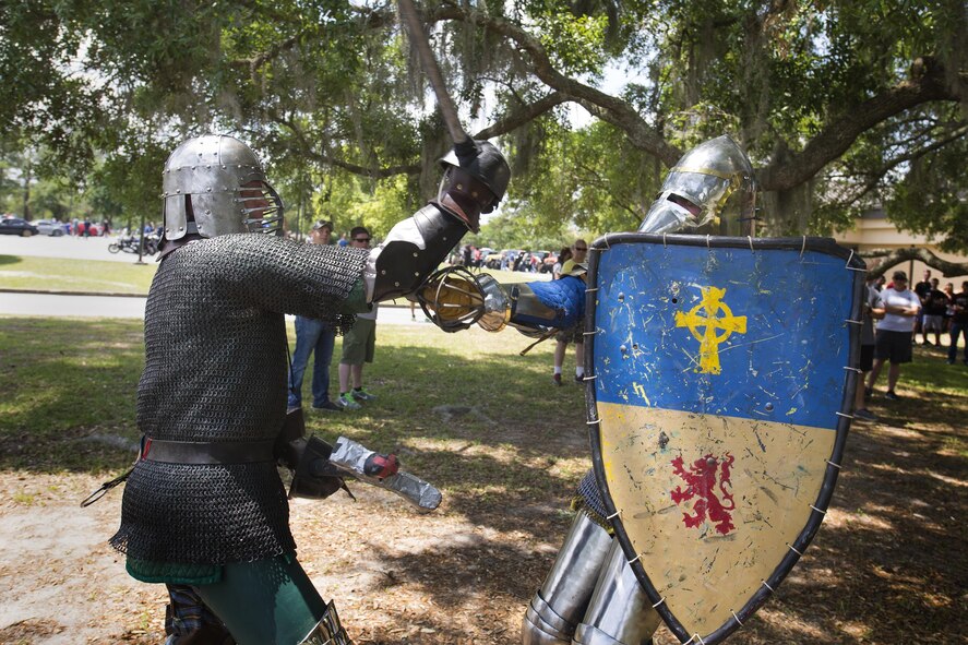 U.S. Air Force Tech. Sgt. Zachary Wolf, 23d Wing NCO in charge of media operations, left, engages in battle with Master Sgt. Brian McAfee, 71st Rescue Squadron loadmaster, during Comprehensive Airmen Fitness day, April 29, 2016, at Moody Air Force Base, Ga. Airmen had the opportunity to showcase their clubs and invite others to join in support of the social pillar. (U.S. Air Force photo by Airman Daniel Snider/Released)