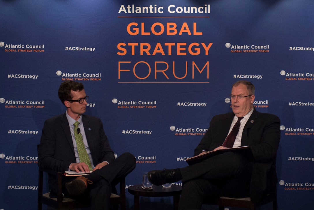 Deputy Defense Secretary Bob Work speaks with event moderator August Cole, Art of the Future Project director, during the Atlantic Council's Global Strategy Forum in Washington, D.C., May 2, 2016. DoD photo by Air Force Senior Master Sgt. Adrian Cadiz