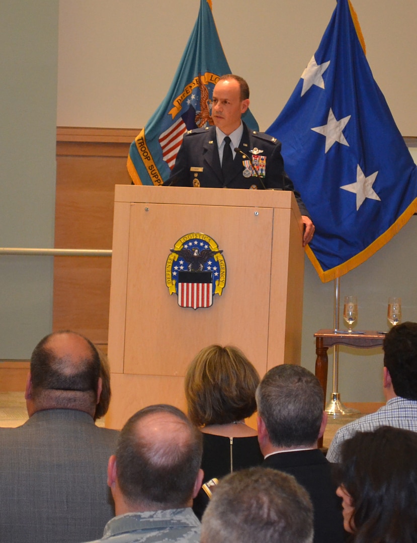 DLA Troop Support Clothing and Textiles Director Air Force Col. Patrick Owens speaks to attendees of his retirement ceremony April 22, marking the end of a 30-year military service career and his tenure at DLA. Owens’ ceremony was attended my friends, family, colleagues, fellow military officers and C&T employees.