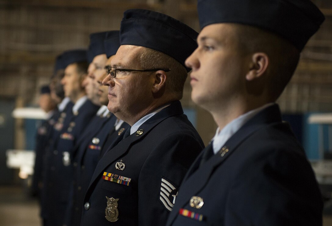 919th Special Operations Wing Airmen stand at attention prior to an open ranks inspection at Duke Field, Fla.  Nineteen of the wing's Air Force Reservists were promoted to higher ranks in May.  (U.S. Air Force photo/Tech. Sgt. Sam King)