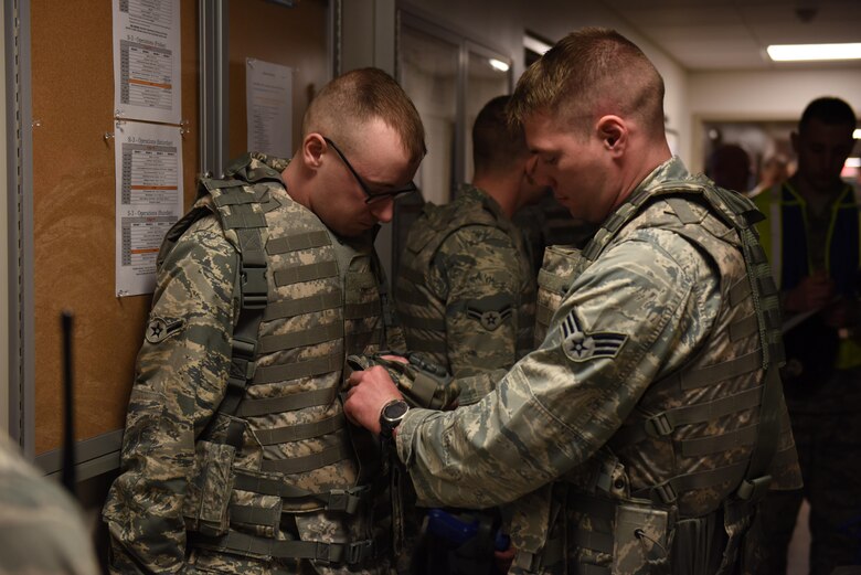 Members of the 911th Security Forces Squadron prepare for a training exercise at the Pittsburgh International Airport Air Reserve Station, April 1, 2016. The exercise tested the fire team’s ability to communicate and respond to an improvised explosive device and an intruder on base. (U.S. Air Force Photo by Airman Bethany Feenstra)