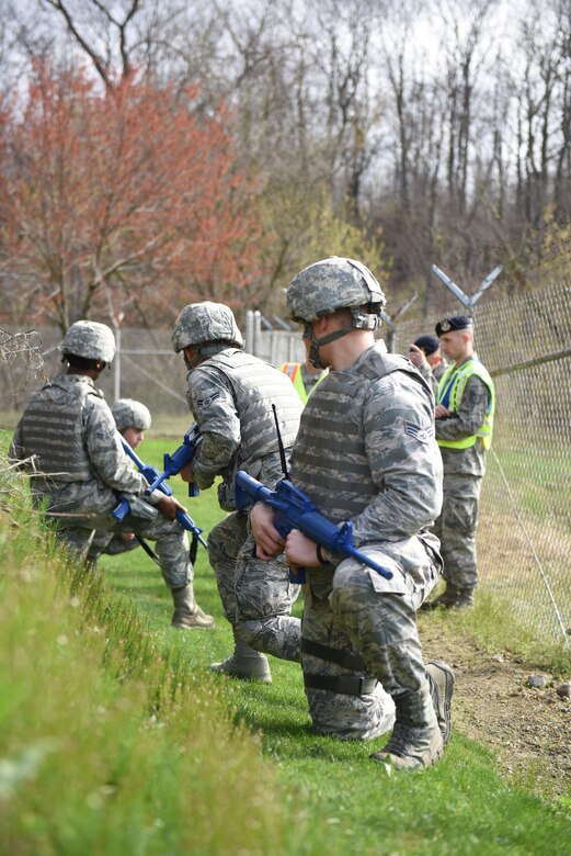 Members of the 911th Security Forces Squadron participate in a perimeter breach exercise at the Pittsburgh International Airport Air Reserve Station, April 1, 2016. The exercise included improvised explosive device recognition and reporting. (U.S. Air Force Photo by Airman Bethany Feenstra)
