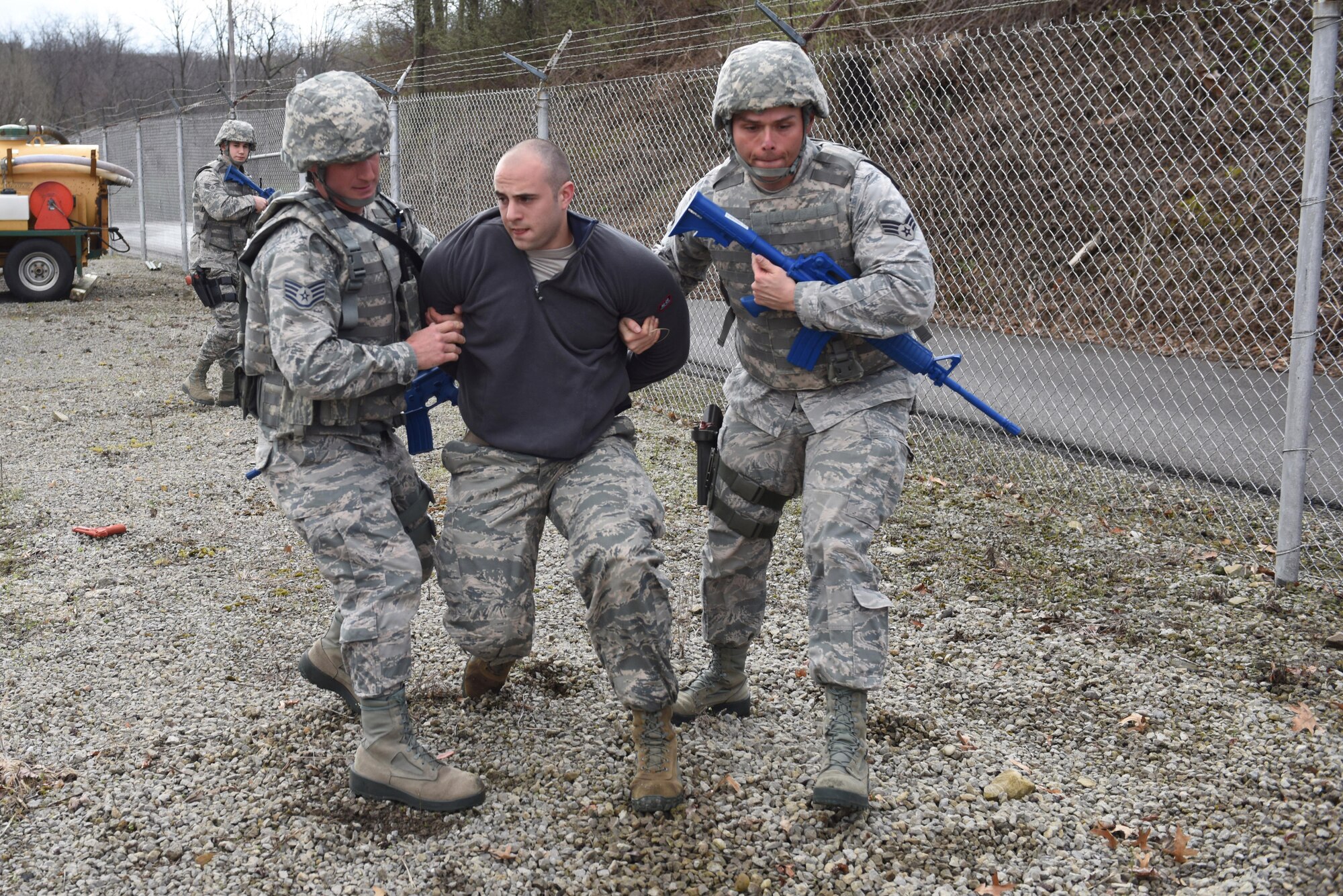 Members of the 911th Security Forces Squadron participate in a perimeter breach exercise at the Pittsburgh International Airport Air Reserve Station, April 1, 2016. The exercise was conducted over the April Academic Unit Training Assembly, a four-day training period designed to give Reserve Airmen an opportunity to update qualifications and conduct career-specific training. (U.S. Air Force Photo by Airman Bethany Feenstra)
