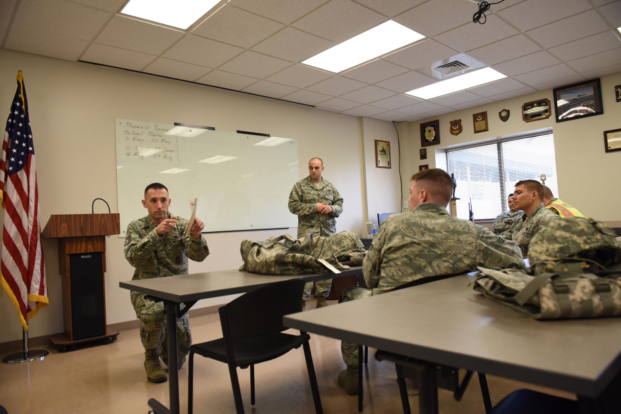 Tech. Sgt. Wenger, training manager with the 911th Security Forces Squadron debriefs his team after they participated in a perimeter breach exercise at the Pittsburgh International Airport Air Reserve Station, April 1, 2016. The exercise was part of the career specific training part of the base’s Academic Unit Training Assembly, a training weekend dedicated to keeping Airmen qualified year round. (U.S. Air Force Photo by Airman Bethany Feenstra)