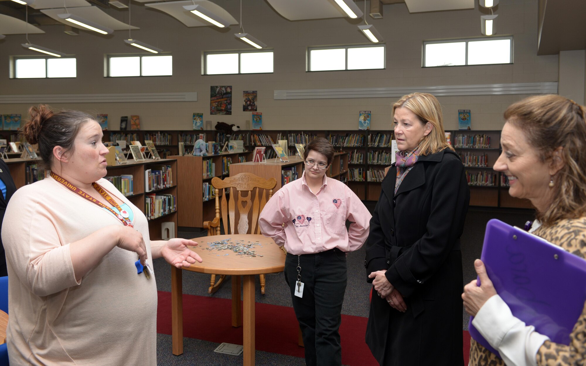 Kim Rand, wife of AFGSC commander Gen. Robin Rand, learns about the Vandenberg Elementary School’s library in Box Elder, S.D., April 27, 2016. The new Vandenberg campus opened its doors during the 2015-2016 schoolyear, and was funded with a combination of Department of Education and Department of Defense grants, and Impact Aid funds. (Air Force photo by Airman Donald C. Knechtel)