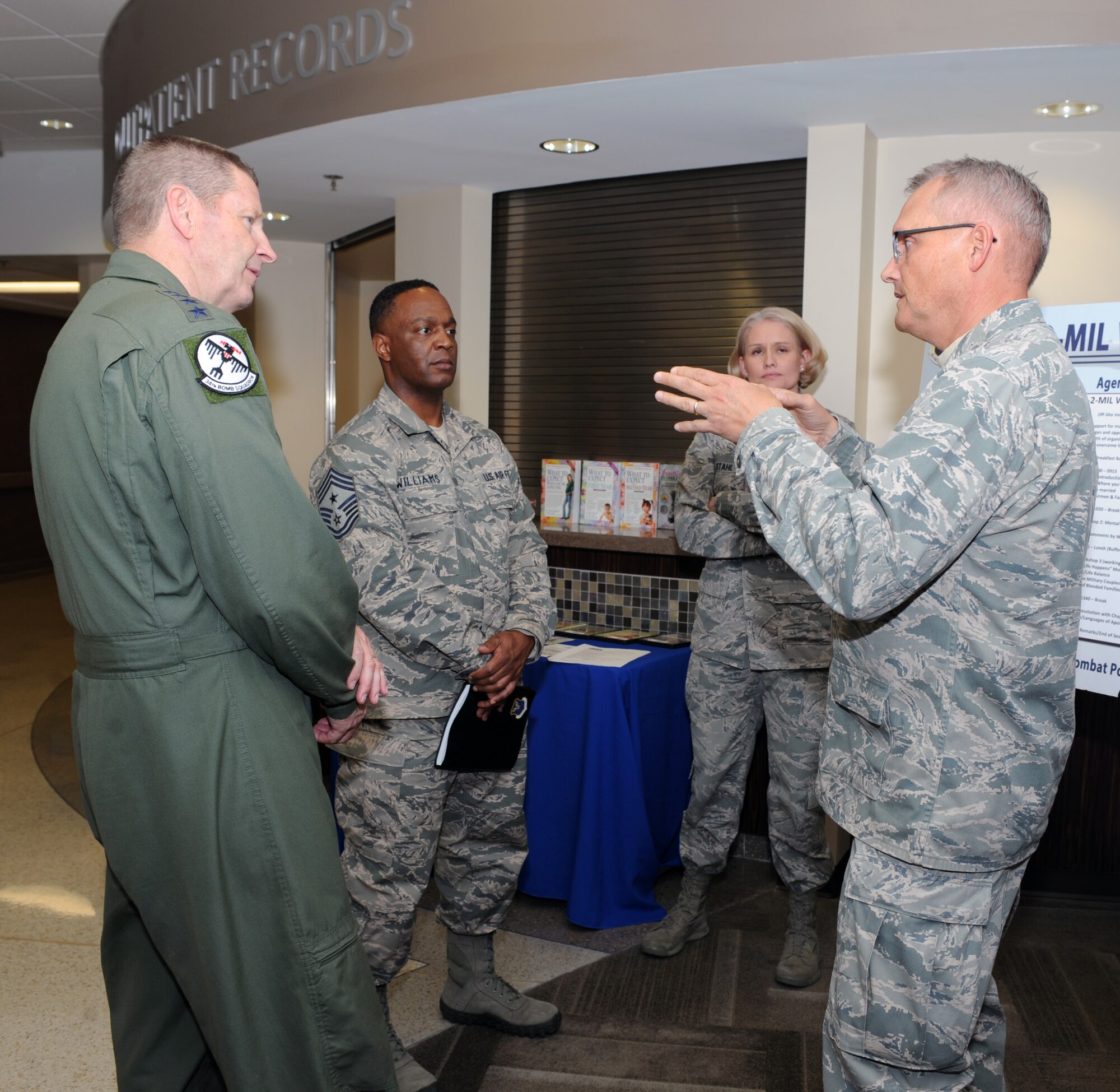 Gen. Robin Rand, AFGSC commander, and Chief Master Sgt. Calvin Williams, AFGSC command chief, learn about the “Mil-to-Mil” program from Chap. (Maj.) David Knight, 28th Bomb Wing chaplain, at Ellsworth AFB, S.D., April 28, 2016. The chapel hosts seminars and retreats for couples, allowing them to take time to focus on fortifying their relationships surrounded by fellow mil-to-mil couples. (Air Force photo by Airman 1st Class Denise M. Nevins)