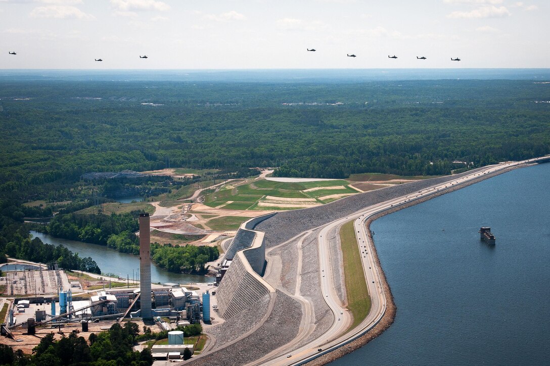 AH-64D Apache helicopters fly in formation over Eastover, S.C., April 23, 2016, to participate in gunnery qualifications and annual training at Fort Stewart, Ga. South Carolina Army National Guard photo by Staff Sgt. Roberto Di Giovine
